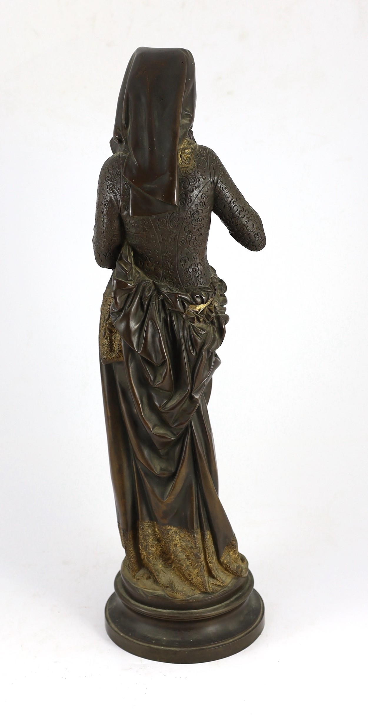 Albert-Ernest Carrier-Belleuse (French, 1824-1887). A parcel gilt bronze and ivory figure, 'Liseuse', height 60cm